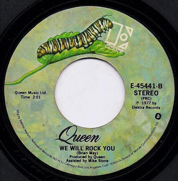 Queen : We Are The Champions / We Will Rock You (7", Single, Styrene, PRC)