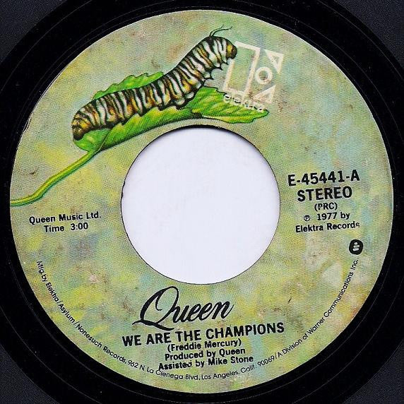 Queen : We Are The Champions / We Will Rock You (7", Single, Styrene, PRC)